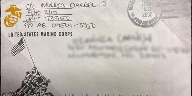 Envelope with address blurred out. Sender written in top left is from a Marine