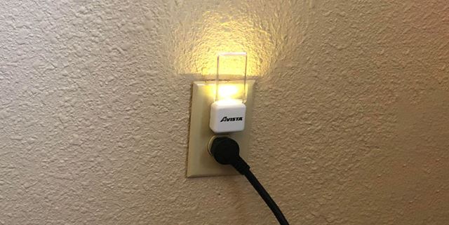 Small night light plugged into a wall