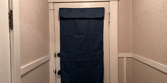 Doorway with a blue curtain covering it