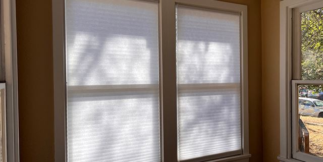Blinds covering a window in the kitchen