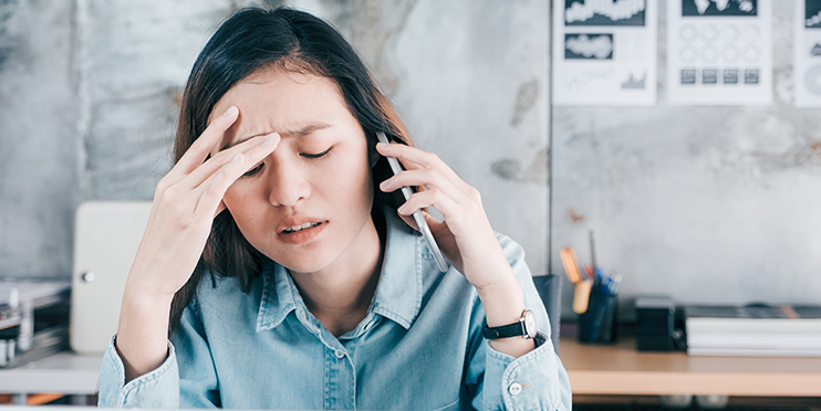 Frustrated woman on phone