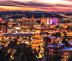 Nighttime panoramic view of Spokane city skyline downtown